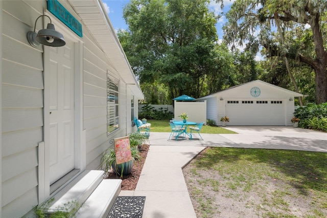 12335 SE 130th Ct, Ocklawaha, FL 32179 - view of yard featuring a detached garage and an outdoor structure