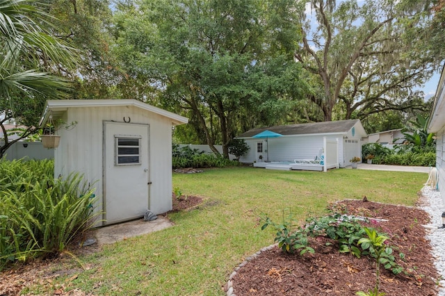 12335 SE 130th Ct, Ocklawaha, FL 32179 - view of grassy yard featuring a garage