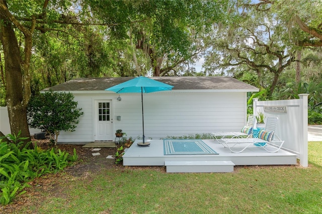 12335 SE 130th Ct, Ocklawaha, FL 32179 - rear view of property with a yard and a deck