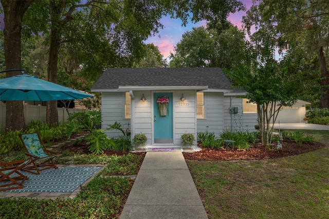 12335 SE 130th Ct, Ocklawaha, FL 32179 - view of front of home featuring roof with shingles