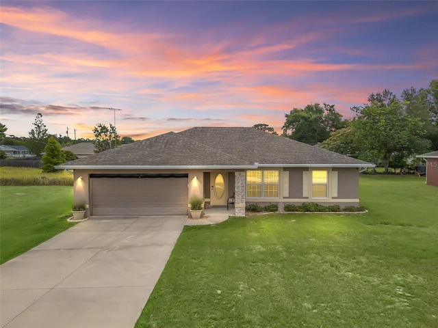 11 Pecan Course Loop, Ocala, FL 34472 - single story home featuring an attached garage, concrete driveway, a lawn, stucco siding, and roof with shingles
