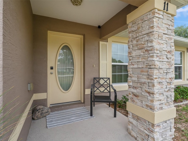 11 Pecan Course Loop, Ocala, FL 34472 - view of exterior entry featuring stucco siding