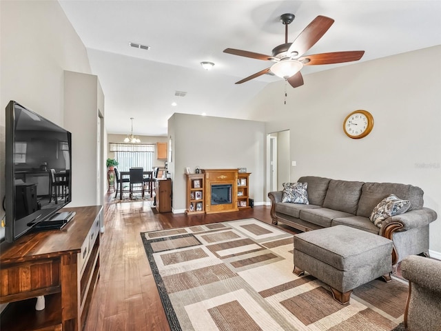 11 Pecan Course Loop, Ocala, FL 34472 - living area with dark wood-type flooring, ceiling fan, vaulted ceiling, and a chandelier