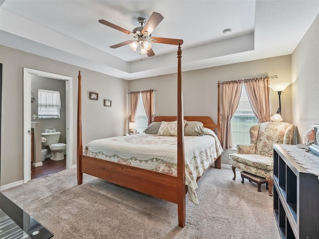 11 Pecan Course Loop, Ocala, FL 34472 - bedroom with a raised ceiling, light carpet, multiple windows, and baseboards