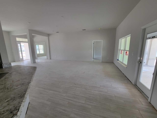 15055 SW 25th Cir, Ocala, FL 34473 - unfurnished living room with light wood finished floors