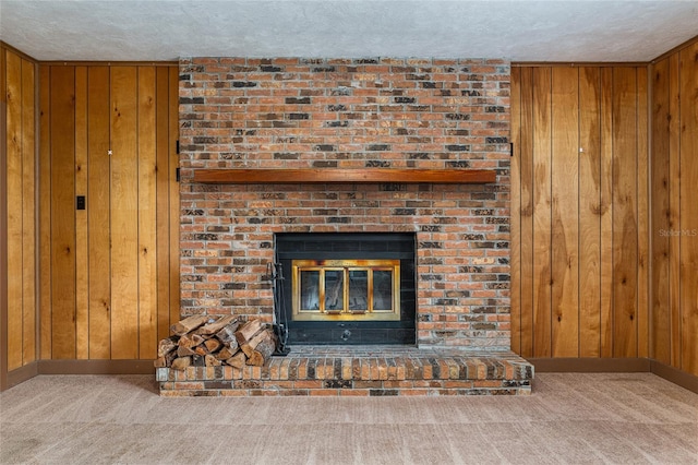3621 SE 12th Pl, Ocala, FL 34471 - detailed view of wooden walls, carpet, a textured ceiling, a fireplace, and baseboards