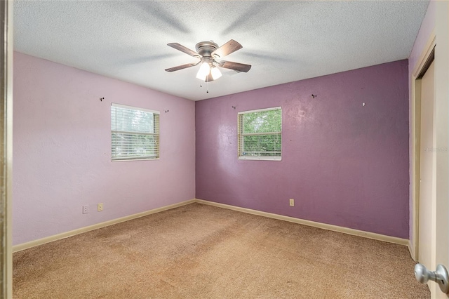 3621 SE 12th Pl, Ocala, FL 34471 - unfurnished room with plenty of natural light, carpet, ceiling fan, and a textured ceiling