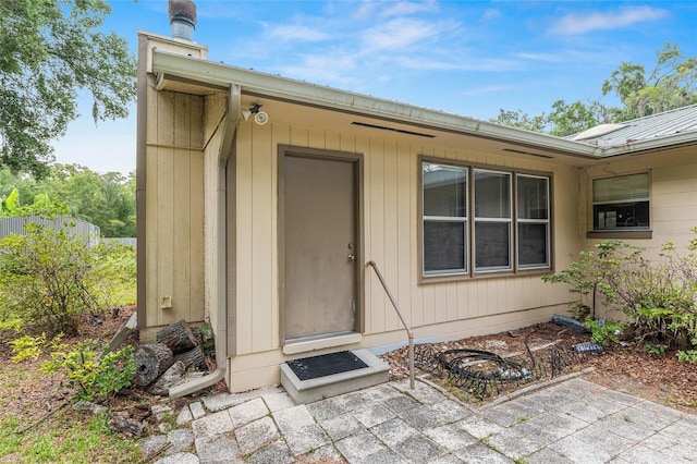 3621 SE 12th Pl, Ocala, FL 34471 - property entrance with metal roof and a patio