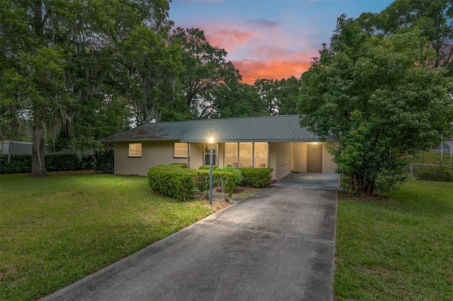 3621 SE 12th Pl, Ocala, FL 34471 - ranch-style house with concrete driveway, a carport, and metal roof