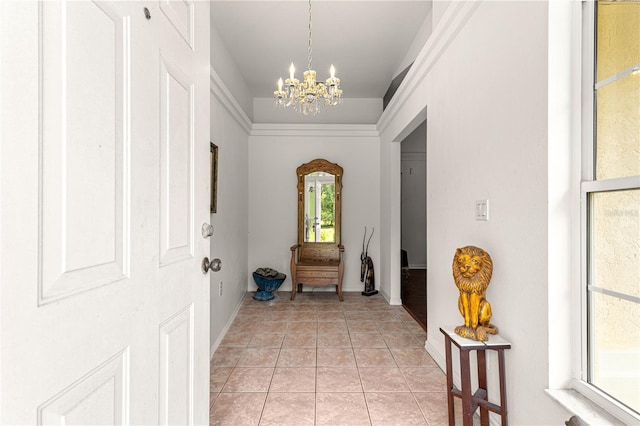 5445 NE Anthony Rd, Ocala, FL 34475 - foyer with a chandelier, baseboards, and light tile patterned flooring