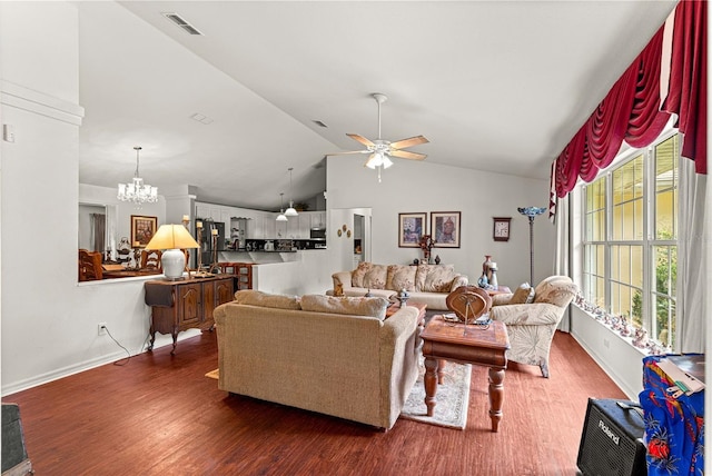 5445 NE Anthony Rd, Ocala, FL 34475 - living room featuring a chandelier, wood finished floors, lofted ceiling, a ceiling fan, and baseboards