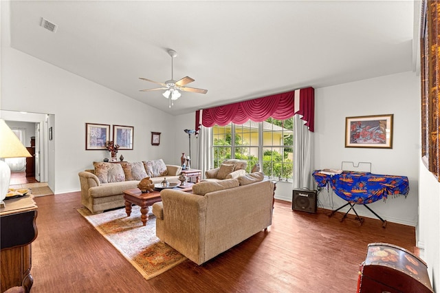 5445 NE Anthony Rd, Ocala, FL 34475 - living room with ceiling fan, wood finished floors, vaulted ceiling, and baseboards