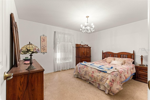 5445 NE Anthony Rd, Ocala, FL 34475 - bedroom featuring light carpet, a chandelier, and baseboards