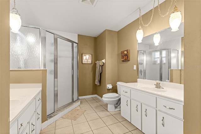 5445 NE Anthony Rd, Ocala, FL 34475 - full bathroom with two vanities, tile patterned floors, a stall shower, and toilet
