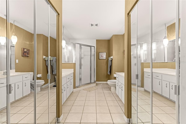5445 NE Anthony Rd, Ocala, FL 34475 - full bath featuring toilet, vanity, a stall shower, and tile patterned flooring