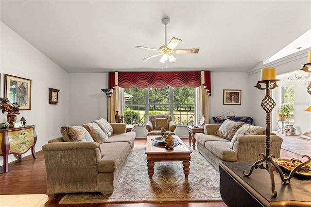 5445 NE Anthony Rd, Ocala, FL 34475 - living room with vaulted ceiling, a ceiling fan, and wood finished floors