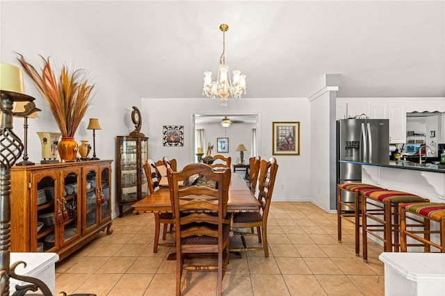 5445 NE Anthony Rd, Ocala, FL 34475 - dining room with a chandelier and light tile patterned floors