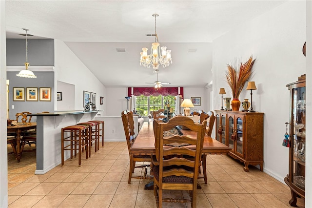 5445 NE Anthony Rd, Ocala, FL 34475 - dining space with light tile patterned floors, a chandelier, vaulted ceiling, baseboards, and ceiling fan