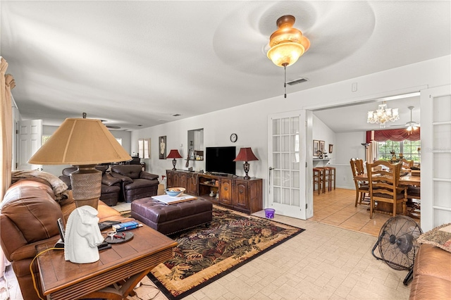 5445 NE Anthony Rd, Ocala, FL 34475 - living area featuring a chandelier and ceiling fan