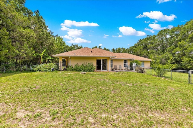 5445 NE Anthony Rd, Ocala, FL 34475 - rear view of property featuring stucco siding, a patio area, and an attached garage