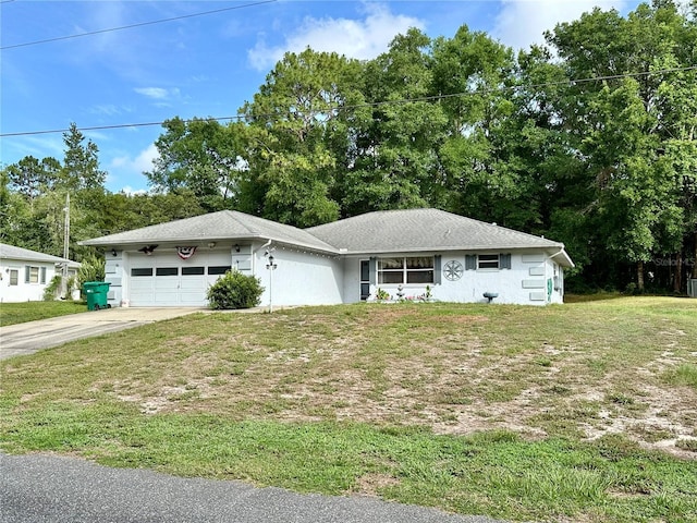 2020 W Snowy Egret Pl, Citrus Springs, FL 34434 - view of front of property with an attached garage, driveway, a front lawn, and stucco siding