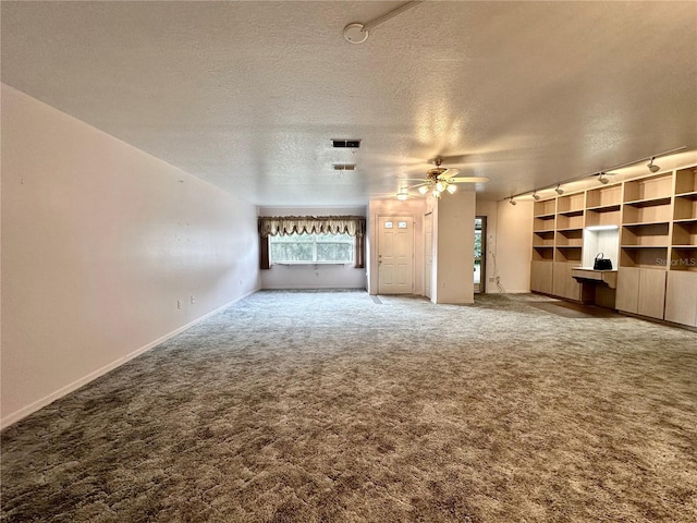 2020 W Snowy Egret Pl, Citrus Springs, FL 34434 - unfurnished living room with a textured ceiling, carpet, ceiling fan, and healthy amount of natural light