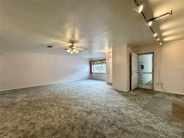 2020 W Snowy Egret Pl, Citrus Springs, FL 34434 - empty room featuring a textured ceiling, carpet flooring, ceiling fan, and baseboards