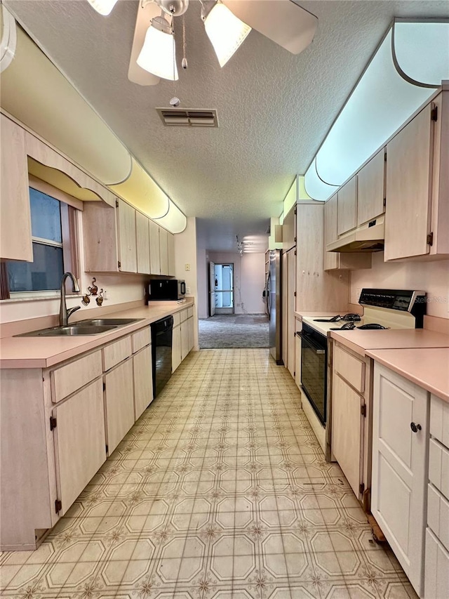 2020 W Snowy Egret Pl, Citrus Springs, FL 34434 - kitchen with black appliances, a sink, a textured ceiling, light countertops, and under cabinet range hood