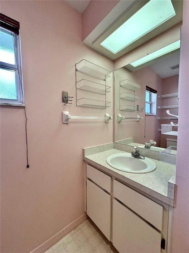 2020 W Snowy Egret Pl, Citrus Springs, FL 34434 - bathroom featuring vanity, tile patterned floors, and baseboards