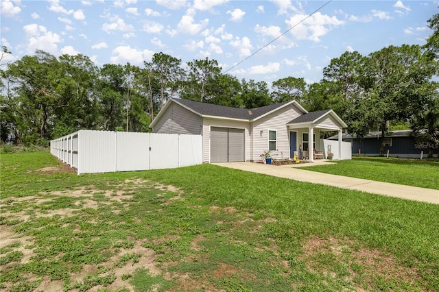 5063 SE 168th Ter, Ocklawaha, FL 32179 - ranch-style home featuring concrete driveway and an attached garage