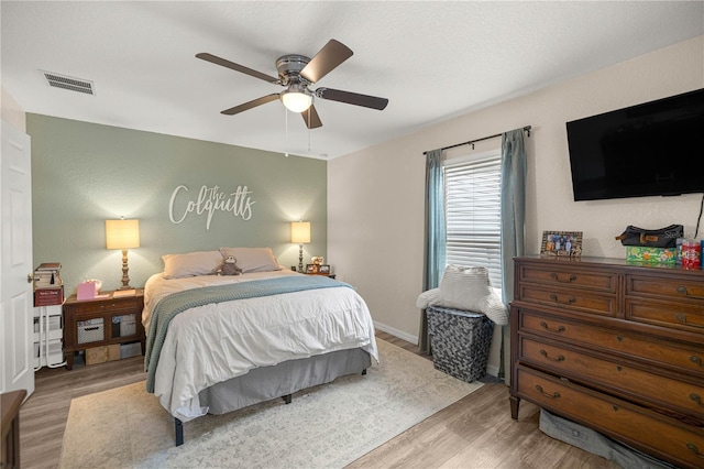5063 SE 168th Ter, Ocklawaha, FL 32179 - bedroom featuring wood finished floors and ceiling fan