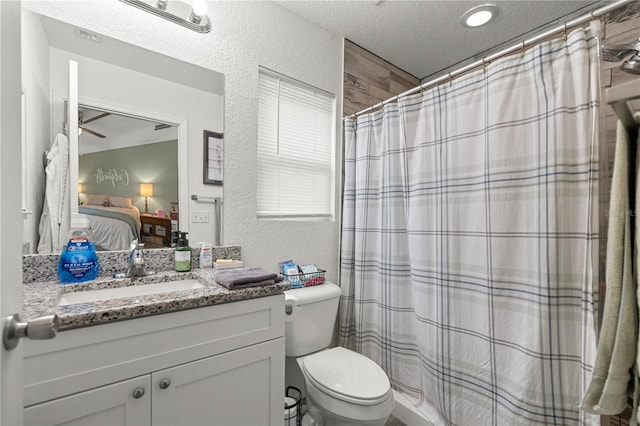 5063 SE 168th Ter, Ocklawaha, FL 32179 - bathroom featuring a textured ceiling, a textured wall, ensuite bathroom, vanity, and toilet