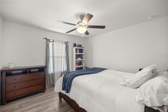 5063 SE 168th Ter, Ocklawaha, FL 32179 - bedroom featuring wood finished floors and ceiling fan