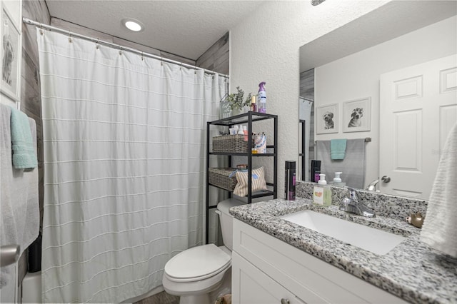 5063 SE 168th Ter, Ocklawaha, FL 32179 - full bathroom with vanity, toilet, a textured ceiling, and a textured wall