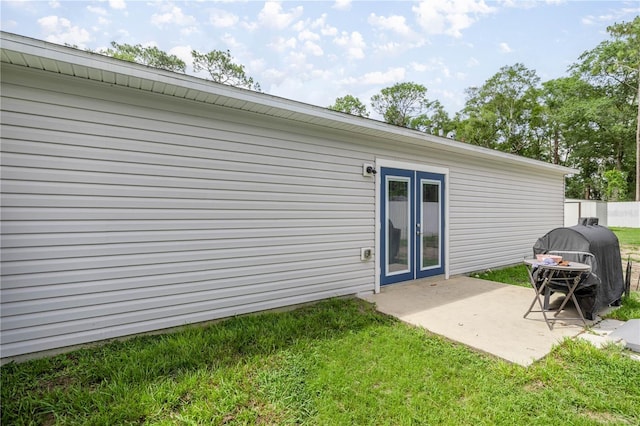 5063 SE 168th Ter, Ocklawaha, FL 32179 - back of property with a patio area and a yard