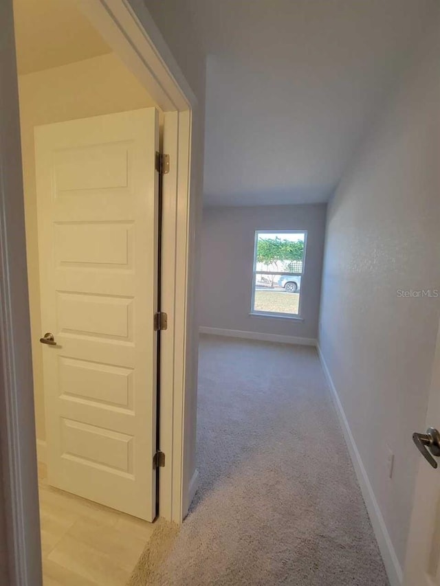 13977 SW 81st St, Dunnellon, FL 34432 - corridor with baseboards and light carpet