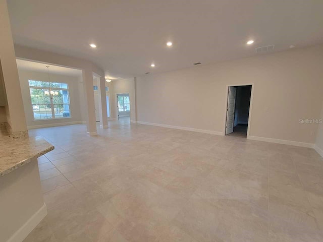 13977 SW 81st St, Dunnellon, FL 34432 - spare room featuring recessed lighting, a chandelier, baseboards, and light tile patterned floors