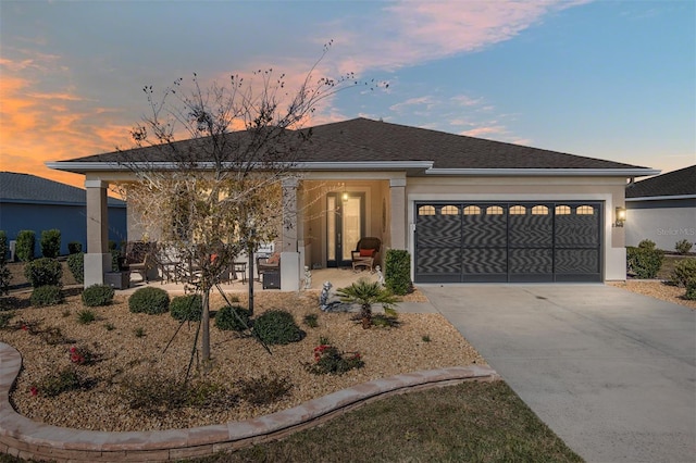 8878 SW 103rd Cir, Ocala, FL 34481 - view of front of property with a garage, concrete driveway, and stucco siding