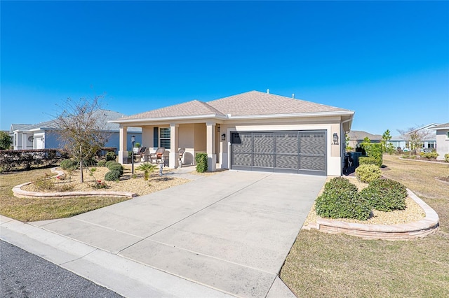 8878 SW 103rd Cir, Ocala, FL 34481 - single story home with an attached garage, a porch, stucco siding, concrete driveway, and a front yard