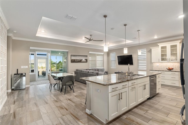 8878 SW 103rd Cir, Ocala, FL 34481 - kitchen with a sink, a raised ceiling, dishwasher, white cabinets, and ornamental molding