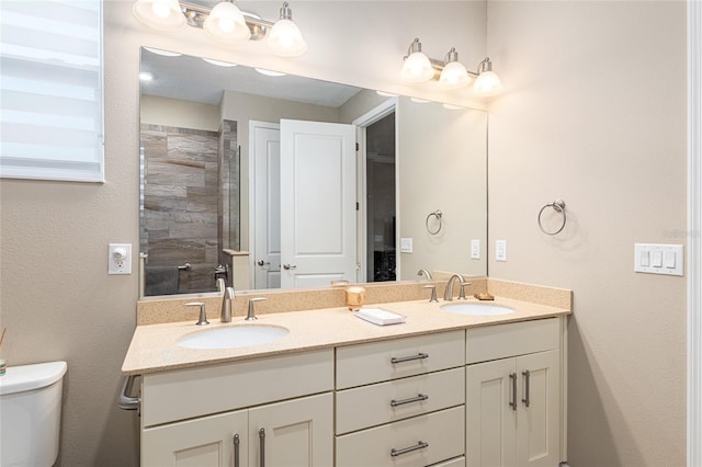 8878 SW 103rd Cir, Ocala, FL 34481 - bathroom featuring double vanity, toilet, and tiled shower
