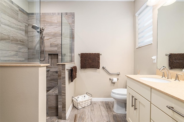 8878 SW 103rd Cir, Ocala, FL 34481 - full bathroom featuring vanity, toilet, walk in shower, and baseboards