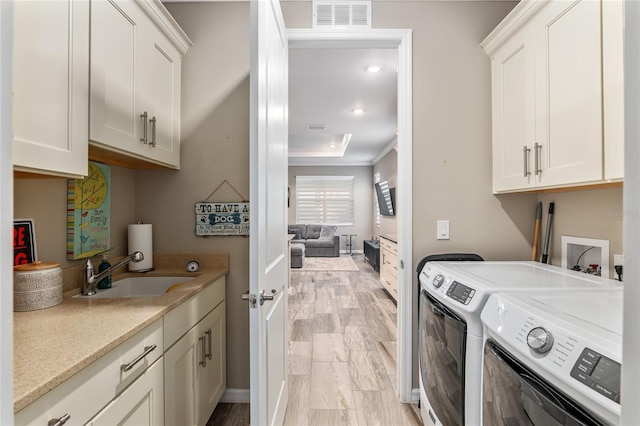 8878 SW 103rd Cir, Ocala, FL 34481 - washroom featuring independent washer and dryer, cabinet space, and crown molding