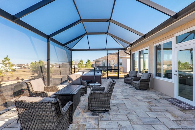 8878 SW 103rd Cir, Ocala, FL 34481 - view of patio / terrace featuring a hot tub, an outdoor living space, and a lanai