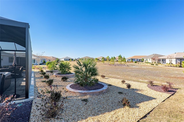 8878 SW 103rd Cir, Ocala, FL 34481 - view of yard featuring a residential view and glass enclosure