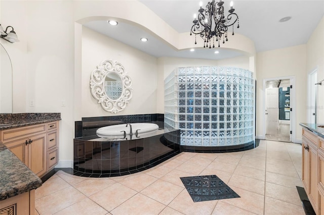 659 NW 155th Way, Newberry, FL 32669 - bathroom with a chandelier, a garden tub, vanity, tile patterned floors, and recessed lighting