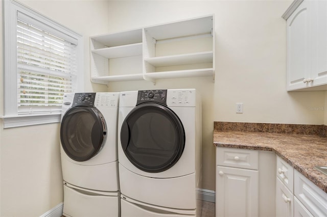 659 NW 155th Way, Newberry, FL 32669 - washroom featuring separate washer and dryer and cabinet space