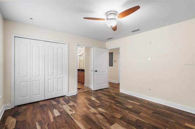 659 NW 155th Way, Newberry, FL 32669 - unfurnished bedroom with electric panel, a closet, wood finished floors, ensuite bath, and a ceiling fan