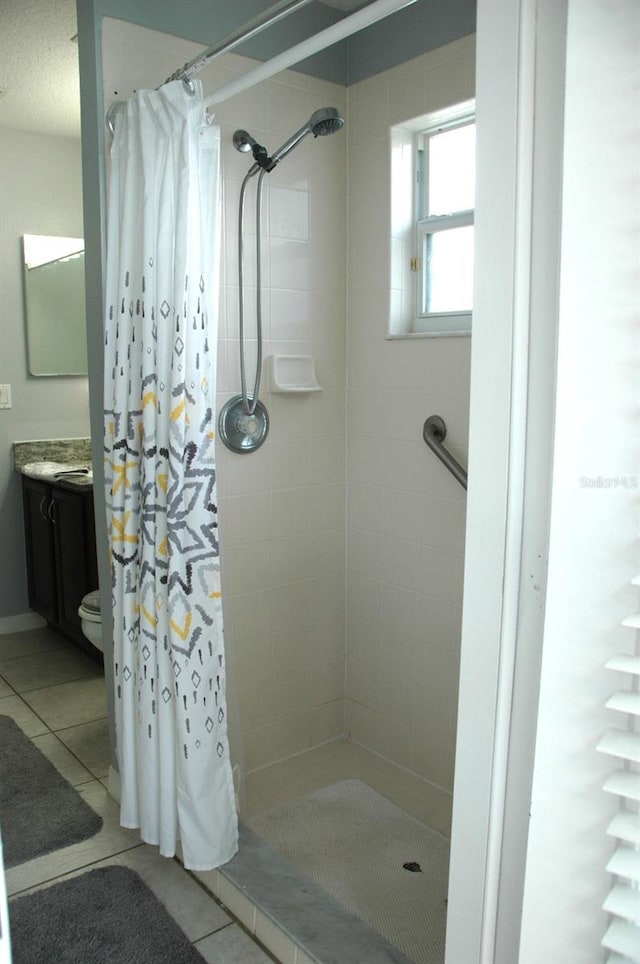 14126 Greater Pines Blvd, Clermont, FL 34711 - full bath featuring tile patterned floors, a tile shower, vanity, and toilet