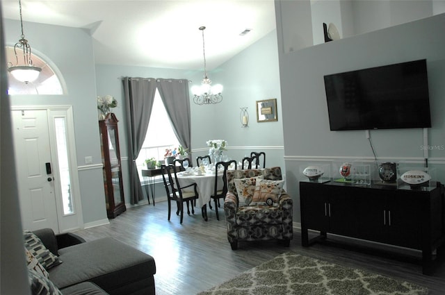 14126 Greater Pines Blvd, Clermont, FL 34711 - living room featuring a chandelier, wood finished floors, high vaulted ceiling, and baseboards